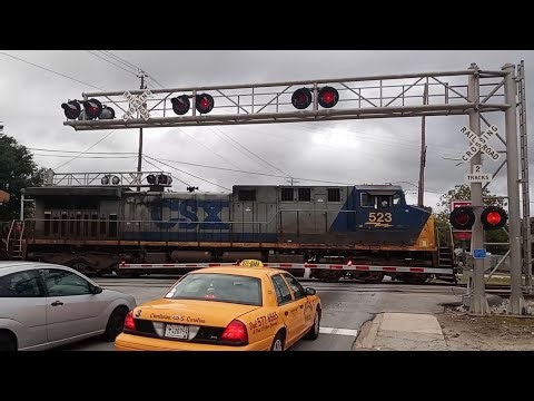 CSXT 523 Leads CSX Train M491 Through The Remount Road Crossing In North Charleston SC