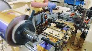 Industrial machine wrapping candies. Candy factory. Modern industrial machine wrapping tasty sweets and putting them on conveyor on confectionery factory. 4K Stock Video