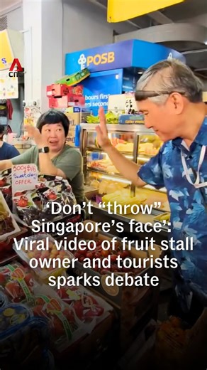 CNA on Instagram: "It started with a question about grapes - but an exchange between tourists and a fruit stall owner in Chinatown went sideways fast, with a viral video that sparked a bigger conversation about customer service and what kind of welcome visitors get in Singapore. Some Singaporeans apologised to the tourists in the comments section, while others have suggested the stallholder might not have reacted that way without reason. #sgnews #singapore"
