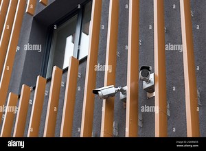 Security cameras on modern building. Professional surveillance camera. CCTV on the wall with LED IR lights. Security system, technology concept. Video Stock Photo - Alamy
