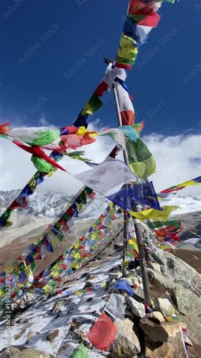 Prayer flags pole on the top of Tsergo Ri (4,990m) the high point on the Langtang valley trek of Nepal. The prayer flags initiate peace and good tidings, their sacred mantras etched on the wind.