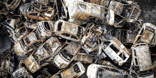 Burned cars and Russian military vehicles create an auto graveyard in Ukraine