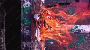 slow motion video art scary Halloween pumpkins ignition from gasoline smoke and fire preparation for celebration in a scary place