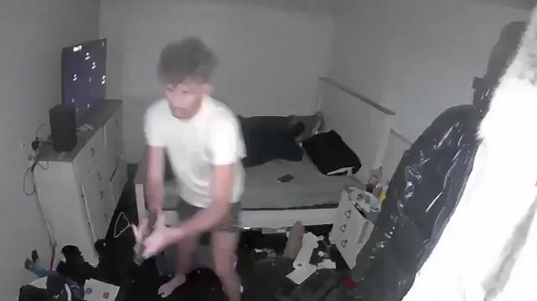 🚨WATCH: Two armed suspects broke into 24-year-old Benjamin Nevers' apartment through a kitchen window while he and his girlfriend were sleeping. Nevers, awakened by the noise, grabbed his handgun. Security footage captured the chaotic shootout inside the home as one intruder entered the bedroom area and opened fire. The injured suspect, identified as Phillip Price, fled but was later arrested. He faces 21 felony charges, including two counts of assault with intent to murder, armed robbery, and