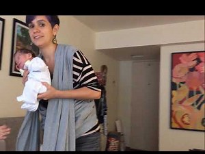 Cruz envuelta con fular semi elasticado, ejemplo con recién nacido.