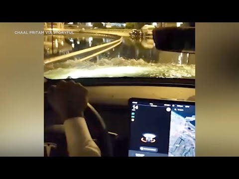 Tesla cuts through flood waters in Dubai while other cars got stuck