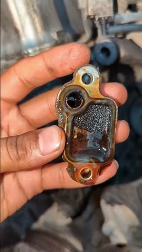 Variable Valve Timing (VTEC) solenoid gasket with a filter from a Honda engine. #honda #vtec #repair