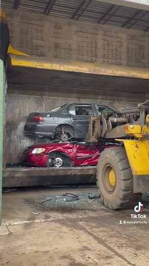 1998 Chevy Malibu in the car crusher at Auto Parts City