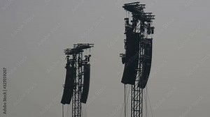 Line array loudspeakers and lights tower for an outdoor concert