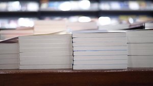 Download stack of books on wooden table for free