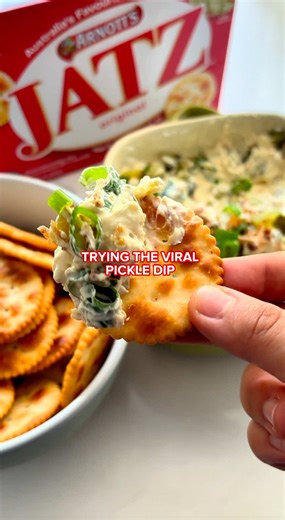 Don’t make this if you don’t love pickles! 🥒 We’ve taken inspiration from @Kirrily to try this simple pickle dip with Jatz crackers - the perfect blend of creamy and crunchy. Are you going to try this one? 👀 Ingredients: - Arnott’s Jatz crackers - 1 tbsp sour cream - 2 tbsp Greek yogurt - 200g cream cheese - 1 tbsp French onion soup powder - 1 jar pickles - Garnish: Crispy shallots, spring onion Method: 1. Mix sour cream, Greek yogurt, cream cheese, French onion soup powder, and pickles. Add s