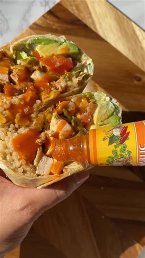 Sheila Williams on Instagram: "when I'm craving chipotle, but don't want to order take out👏🏼 this Chicken Fajita Burrito satisfies that craving! How I made below or comment "recipe" to have sent your way✨ Ingredients (makes 2 large burritos) 2 large boneless chicken thighs 1 tbsp olive oil 1 Tbsp taco seasoning 1 tsp paprika 2 cloves garlic, minced 2 XL burrito flour tortillas 1 cup Somos Mexican Street Corn Rice (microwaveable pouch) 1 large avocado, sliced ½ cup shredded cheese ½ cup shredde