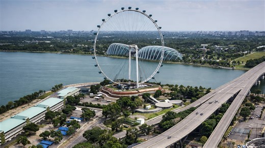 Singapore Flyer rising above Marina Bay waterfront