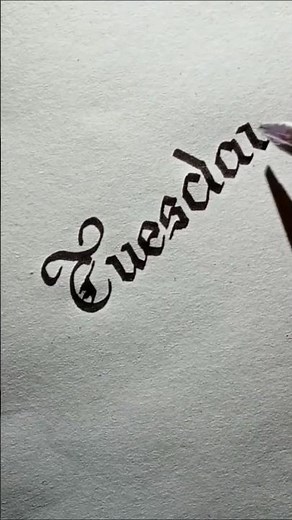 Lettering ' Tuesday ' Old English Handwriting