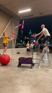 1.1K views | This duo was practicing their juggling skills ahead of a big show. The woman balanced herself on a medicine ball while the man stood on a ladder as they juggled bowling pins with each other. | Jukin Copyright Management | Facebook