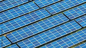 Solar photovoltaic (PV) facility utilizes photovoltaic cells to convert sunlight into electrical energy, contributing to sustainable power generation and reducing carbon emissions. Aerial view drone.