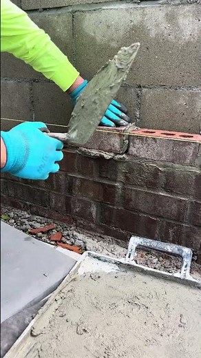 Building a cinder block wall with brick and concrete!