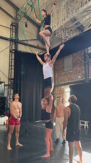 Graceful Female Acrobats Performing Impressive Balancing Act