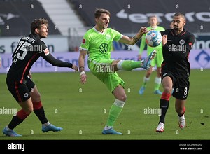 Germany. 12th Feb, 2022. 12 February 2022, Hessen, Frankfurt/Main: Soccer: Bundesliga, Eintracht Frankfurt - VfL Wolfsburg, Matchday 22, Deutsche Bank Park. Frankfurt's Christopher Lenz (l-r), Wolfsburg's Maximilian Philipp and Frankfurt's Djibril Sow in action. Photo: Sebastian Gollnow/dpa - IMPORTANT NOTE: In accordance with the requirements of the DFL Deutsche Fußball Liga and the DFB Deutscher Fußball-Bund, it is prohibited to use or have used photographs taken in the stadium and/or of the m