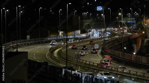 A time-lapse sequence focusing on the luminous trails and road infrastructure visible on a clear night.