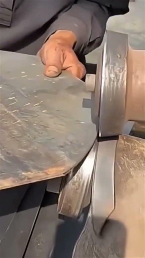 cutting the round metal plate edge precisely using a large industrial rolling shear machine today