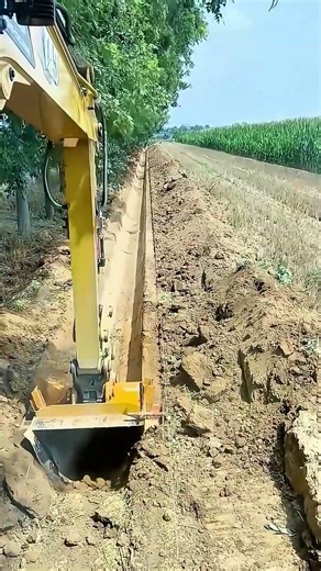 Excavator Equipped with a U Shape Bucket Excavating a Trench