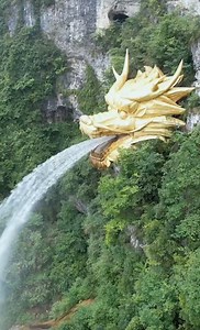 49K views · 2.8K reactions | Take a look at this man-made landmark at a scenic spot in Longli, Guizhou. The dragon head waterfall spout was built on a steep cliff with tons of bronze. #Travel #Autumn #MidAutumnFestival #FunChina | China Plus Culture | Facebook