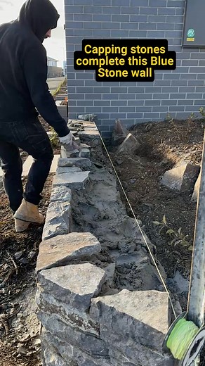 Putting the final touches on this Wee Jasper (bluestone) retaining wall. #canbe | Harry Nelson