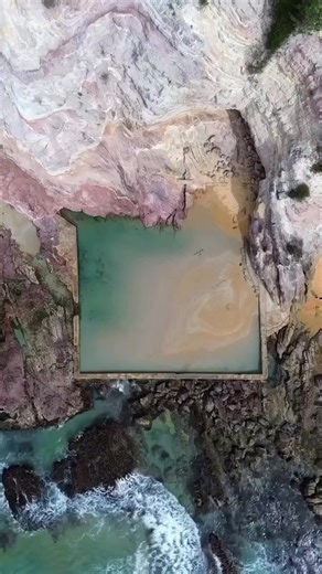 Did we find the rock pool of your summer dreams?? Aslings Beach Rock Pool found in the beautiful coastal town of Eden Visitor Information Centre on the Sapphire Coast NSW. 😍 Surrounded by dramatic pink and white cliffs, you'll find this stunning and unique swimming spot. It is a must-visit for anyone who loves a splash in the ocean and being surrounded by remarkable nature. Thanks for sharing your #feelNSW moments @shell.beright. | Visit NSW