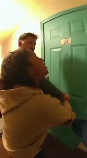 Police body cam footage inside a mobile home. A couple is engaged in a loud verbal fight in the narrow living space, one person pointing and yelling. Officers enter, issue firm commands, separate both individuals into different rooms, and stabilize the scene | BodyCam Vault