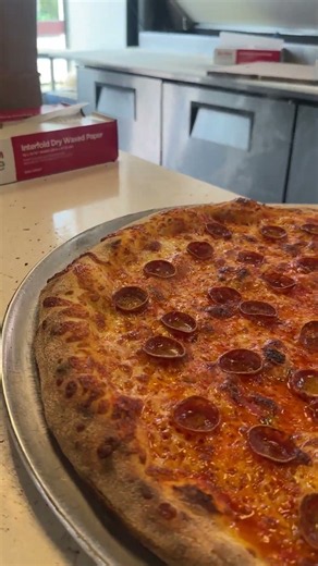 Large light pepperoni pizza fresh out of the oven 🤤
