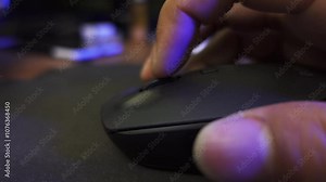 Close-up of man hand clicking computer mouse. Click and scrolling computer mouse. A male hand holding a computer mouse.