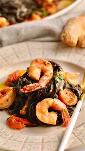 Elena Davis| Italian Recipes on Instagram: "✋🏽If you want some…🖤Squid Ink Pasta Recipe with Shrimp and Cherry Tomato Sauce. An elegant and rustic 🇮🇹Italian pasta dish that combines 🦑squid ink pasta with the subtle briny flavors of shrimp, garlic, white wine, parsley, and 🍅cherry tomatoes—a special delicacy for a date night meal at home or dinner party! 🥰🤩 ✅ FULL RECIPE: tap @cucinabyelena 🔗 IN BIO, or search: “CucinabyElena Squid Ink Pasta“. See my stories for more! ➡️ DM ME AND I’LL SE