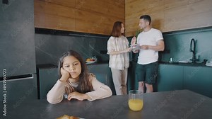 A modern kitchen sets the scene for a family morning routine, encouraging bonding and shared meals in a cozy atmosphere, fostering affection and interaction among family members