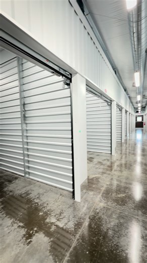 Interior of Storage Center Plus in Lawrenceburg KY showing a bright, clean hallway with polished concrete floors and climate-controlled storage units. | Storage Center Plus - Storage Units in Lawrenceburg, KY