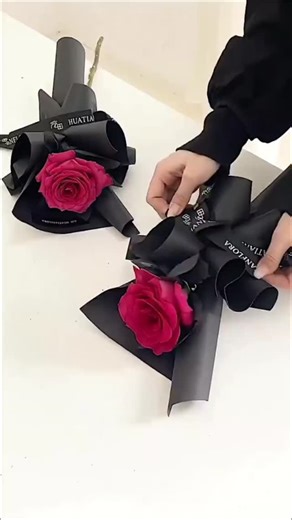 fafaflowercom on Instagram: "Less is more. Especially with roses. One single rose, wrapped perfectly, beats a dozen wrapped poorly. Master this elegant single rose wrapping technique. It’s the definition of quiet luxury. 🖤 The tools make the art. Get this premium matte black paper and branded ribbon. Link in Bio to shop our "Noir Collection" at fafaflower.com. #singlerose #howtowrapflowers #singlerosewrapping #flowerwrappingtutorial #diyrose #wrappinghacks #floristtips #aestheticflowers #moodyf