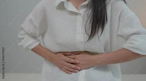 stomach ache. Asian women have abdominal pain, indigestion, gastritis, menstrual cramps, flatulence, diarrhea, distension, colon cancer, belly inflammation problem, suffer food poisoning, abdomen