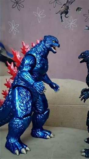 Miku viendo cómo Godzilla se transforma en un robot como Mecha Godzilla