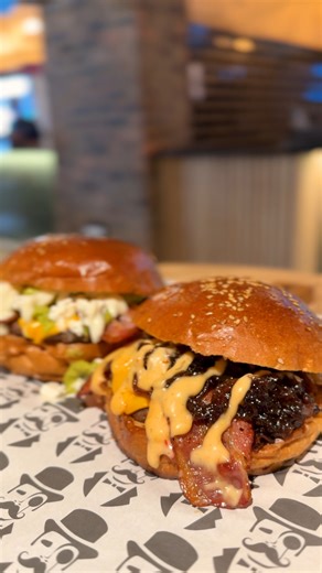 This is statement food. 🍔🔥 The Filthy Moustache at Westown Square serves gourmet burgers and hotdogs that don’t whisper - they shout. #WestownSquare | Westown Square