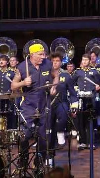 Red Hot Chili Peppers’ Chad Smith performs "The Victors" with the Michigan Marching Band