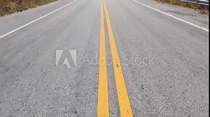 Yellow traffic line color Double solid lines to warn prohibiting overtaking, Yellow continuous tracks of prohibited overtaking painted on the asphalt, Safety driving and traffic regulating rules