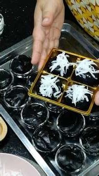 Black sticky rice pudding with a glossy surface, soft and bouncy texture, absolutely delicious.