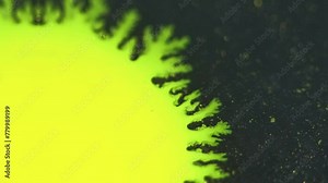 Paint blotch. Ink splash. Sunrise rays. Blur bright yellow color shiny fluid drop blob sphere on dark glitter particles texture abstract opener background .