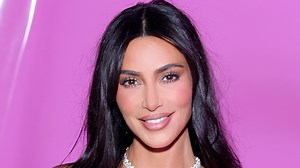 Kim poses in front of $150M private jet in tight leather dress after concert