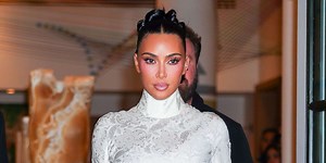 Kim Kardashian Wows in a Tiny Side Boob-Baring String Bikini in a Polarizing Print