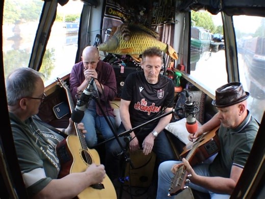 The name of the band, Man at Q and M, comes from an in house Army joke about going ashore in Uniform. All from North Wales, the current line-up comprises of (From the left) Rich Eardley on Bass, David Dudley on Harmonica, Alwyn Burrage on Cajon and their band leader Mark Hedge on Guitar and Lead Vox. The band was originally started by Mark during Covid but has had many different line-up over the years with the latest one only coming about two weeks before the recording with David joining them on