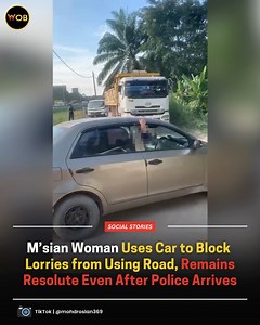 Malaysians were divided in the comments, with some supporting the woman's actions while others criticised her Full article🔗: https://worldofbuzz.com/msian-woman-uses-car-to-block-lorries-from-using-road-remains-resolute-even-after-police-arrives/ | WORLD OF BUZZ