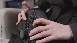 Close-up of opening a medium format film camera. The process of loading film into a film camera.