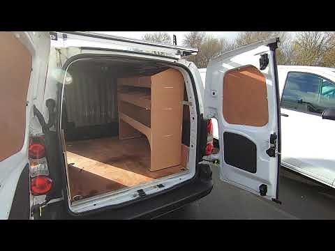 Fitting of a three bar roof rack and roller and plywood shelving units on a Citroen Berlingo L1.