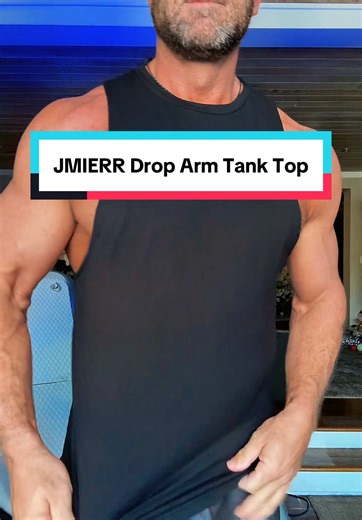 If your tank top hides your physique, you’re wearing the wrong one. The JMIERR Men’s Drop Arm Tank Top is designed with an athletic fit that shows off your chest, shoulders, and lats without feeling tight or restrictive. The drop arm holes provide maximum range of motion, making it perfect for workouts, training days, and summer wear. Made from a soft, breathable cotton blend with stretch, this tank is comfortable, lightweight, and easy to move in. Great for gym sessions, beach days, and casual 